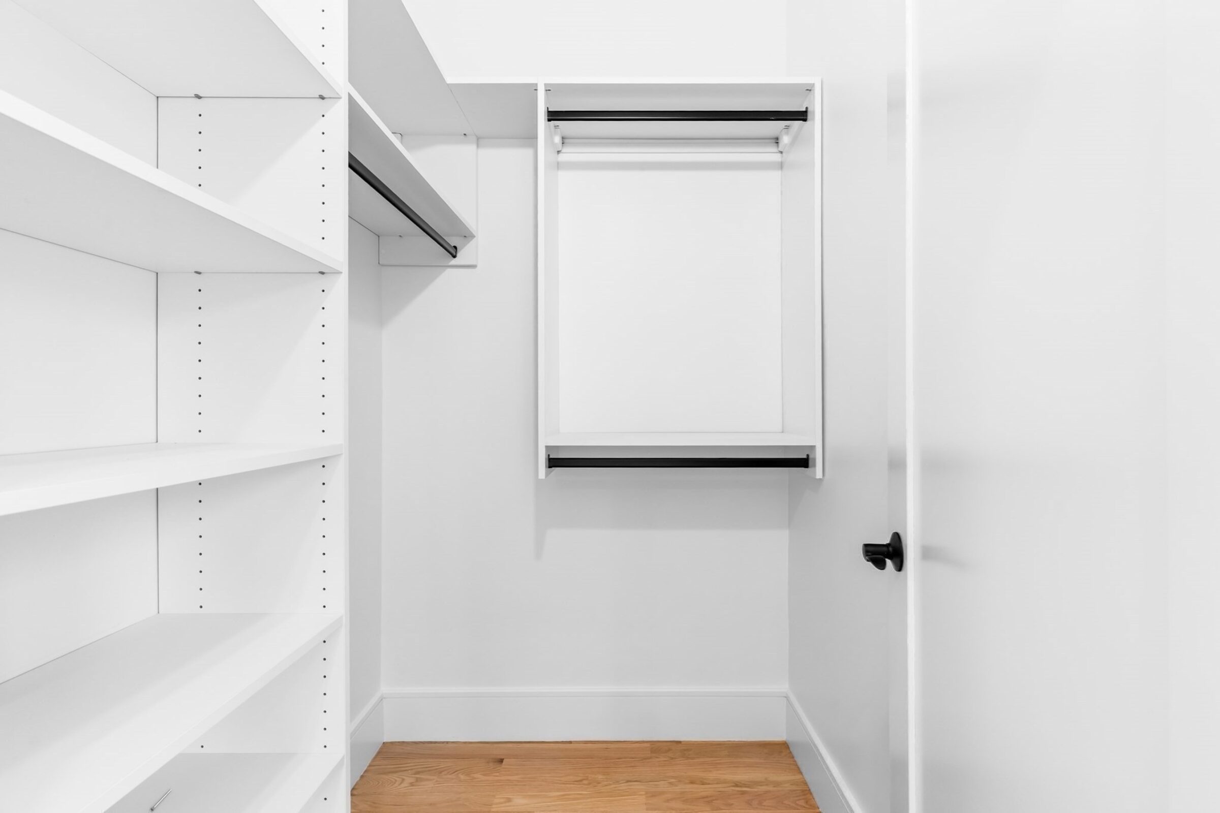 Walk-in closet with built-in shelving.